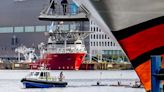 Teil einer europaweiten Aktion - „Wir haben es satt!" - Klimaschützer blockieren zwei Kreuzfahrtschiffe in Kiel