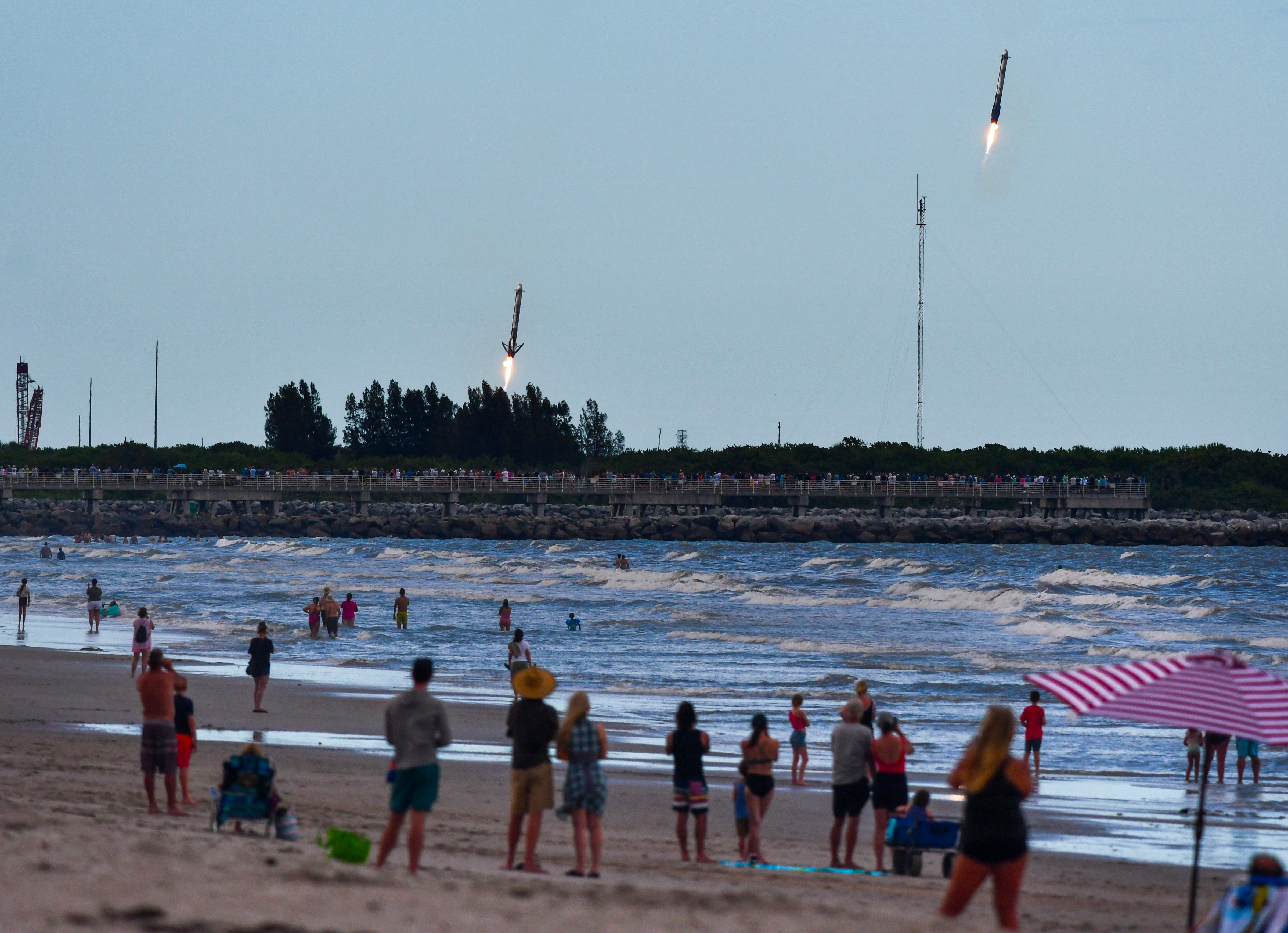 SpaceX Falcon Heavy booster landings, sonic booms wow Kennedy Space Center launch fans