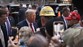 Court-bound Trump gets warm, raucous reception at Manhattan construction site