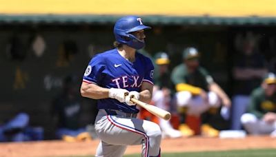 The Texas Rangers tally 10 runs in the second inning and triumph over the Oakland Athletics 15-8