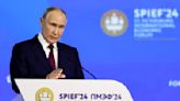 Putin says he sees no threat warranting use of nuclear arms but warns Russia could arm Western foes