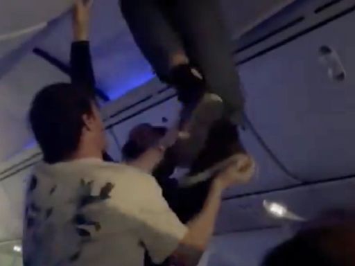 Video shows passenger being pulled from overhead bin after turbulent Air Europa flight