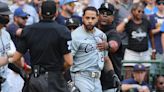 Tommy Pham of the Chicago White Sox is restrained by coaches during the eighth inning against the Milwaukee Brewers at American Family Field on Sunday, June 2...