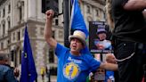 Activists Hijack Boris Johnson Resignation Coverage With ‘Benny Hill’ Theme, Thanks to Hugh Grant