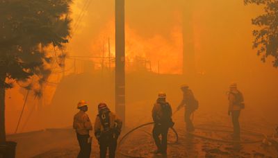 'Moonscape': Airport fire evacuees wait, and hope the blaze spares them