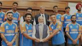 PM Modi holds Rohit Sharma and Rahul Dravid's hands while posing with T20 World Cup champions