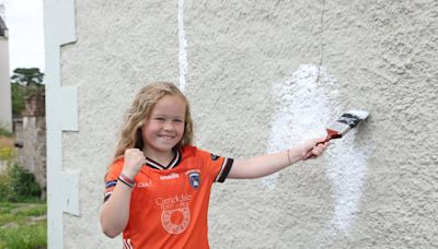 Gaelic-mad Camlough girls help paint house in Orchard county colours ahead of All-Ireland football final