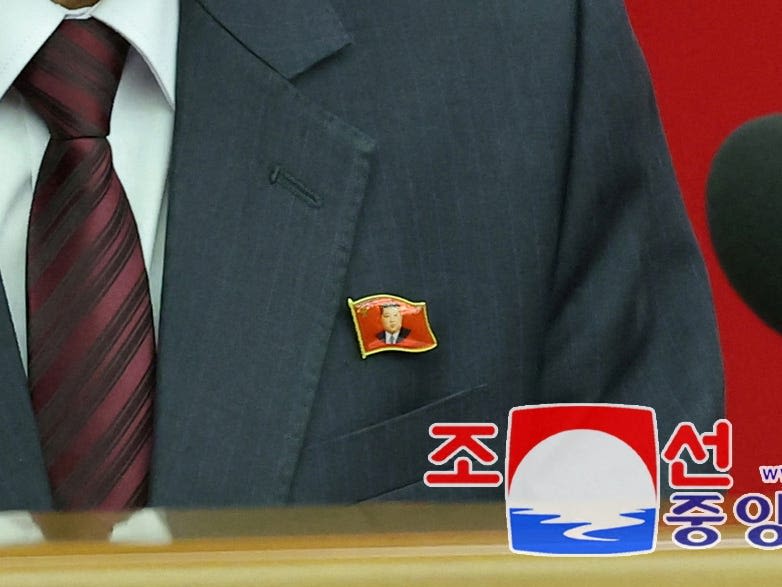 North Koreans have a new fashion accessory — Kim Jong Un lapel pins. Here's what they mean for the supreme leader's legacy.