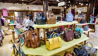 Mulberry boss ousted as handbag maker struggles