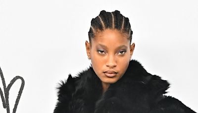 Willow Smith wears a fur coat and thigh-high stockings at PFW