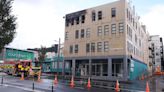 New Zealand police charge suspect after deadly hostel fire
