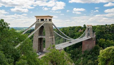 'Body parts' found inside two suitcases dumped on bridge as cops hunt man