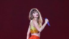 Taylor Shows Wears Chiefs Colors at Paris Concert With Travis Kelce Watching