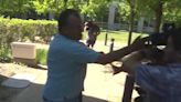 School crossing guard charged with assault violently confronts photographers outside court