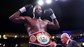 Lawrence Okolie wins bridgerweight world title with ruthless first-round victory over Lukasz Rozanski