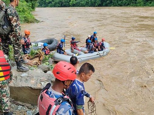 Nepal: 14 bodies found after buses swept into river by landslide, officals say