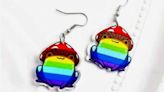 Russian woman faces pre-trial detention for wearing colorful earrings, resembling LGBT pride flag