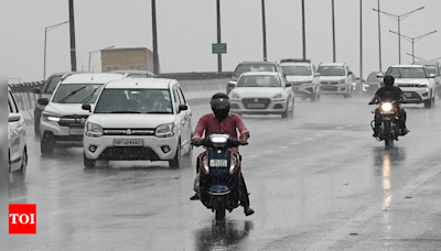 Rainfall in Delhi brings relief amid hot and humid conditions | Delhi News - Times of India