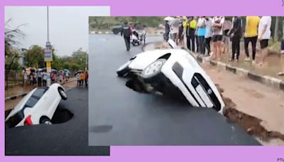 Car trapped as crater develops on road after heavy rain hits Gujarat. Watch video