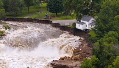 Part of a Minnesota home has plunged into the Blue Earth River as deadly Midwest flooding threatens the nearby Rapidan Dam