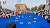 Fight breaks out at massive protest in Tbilisi against foreign agents law – video