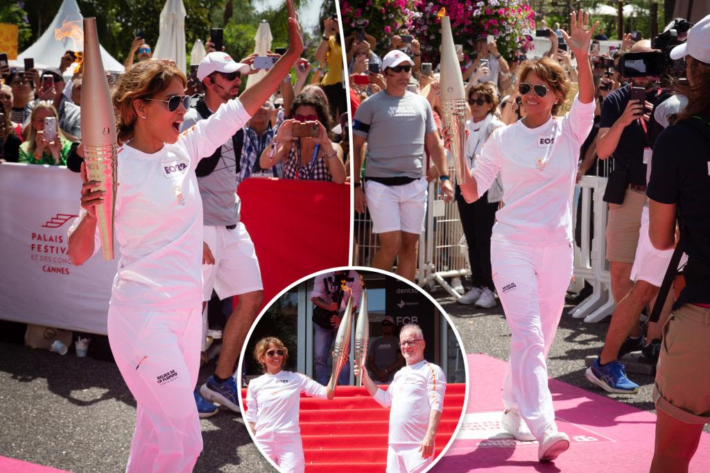 Energized Halle Berry walks Olympic torch down Croisette during Cannes Lions festival