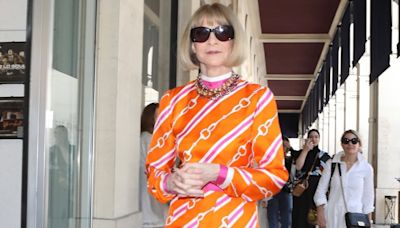 Anna Wintour arrives at Vogue World Paris in a statement orange dress