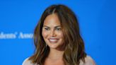 Chrissy Teigen Is Ethereal in Floral-Inspired Strapless Mini Dress