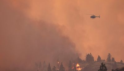 Extreme heat fuels wildfires in Alberta and B.C., forcing hundreds to flee