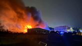 Probe begins into huge fire at car dealership