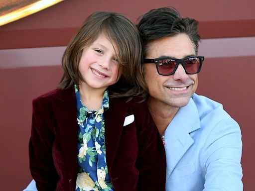 John Stamos' son Billy, six, joins him on stage to play drums