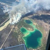 This August 3 2024 image obtained from the Jasper National Park in Canada, shows fire activity near Lake Edith