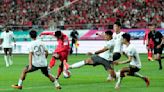 China keeps its World Cup hopes alive despite a 1-0 loss to South Korea. Thailand and India miss out