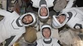 SpaceX Dragon returns astronauts home after months on space station