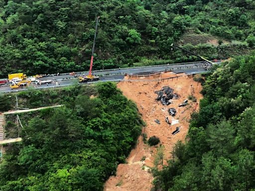 Death toll jumps to at least 48 in southern China highway collapse as search continues