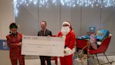 Mercantile Center donates $2,500 to T&G Santa fund at ceremony