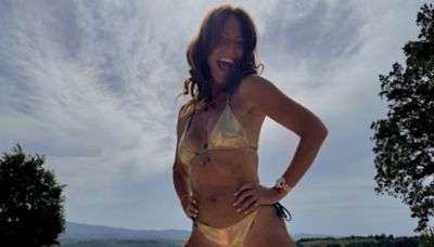 Davina McCall, 56, shows off her toned physique in skimpy gold bikini