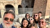 ‘Taking the kids to see my old office’: Gladiator star Russell Crowe takes family selfie outside Colosseum