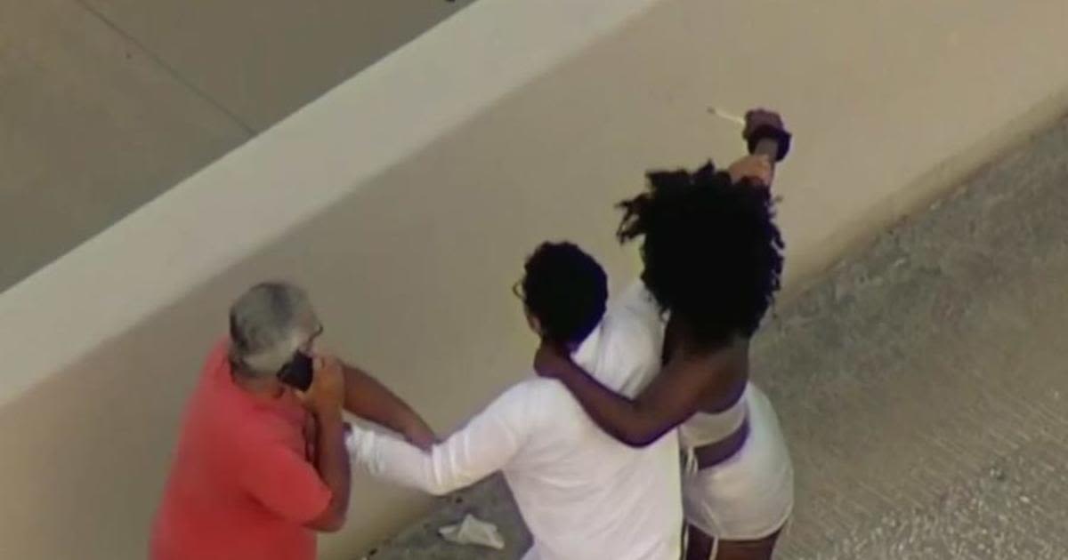 Caught on camera: Woman attacked two men after crash on MacArthur Causeway