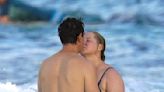 Amy Schumer and Husband Chris Fischer Share a Kiss in the Sea During Romantic St. Bart's Vacation