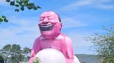 Giant inflatable squatting man which can be seen for miles appears in Welsh town