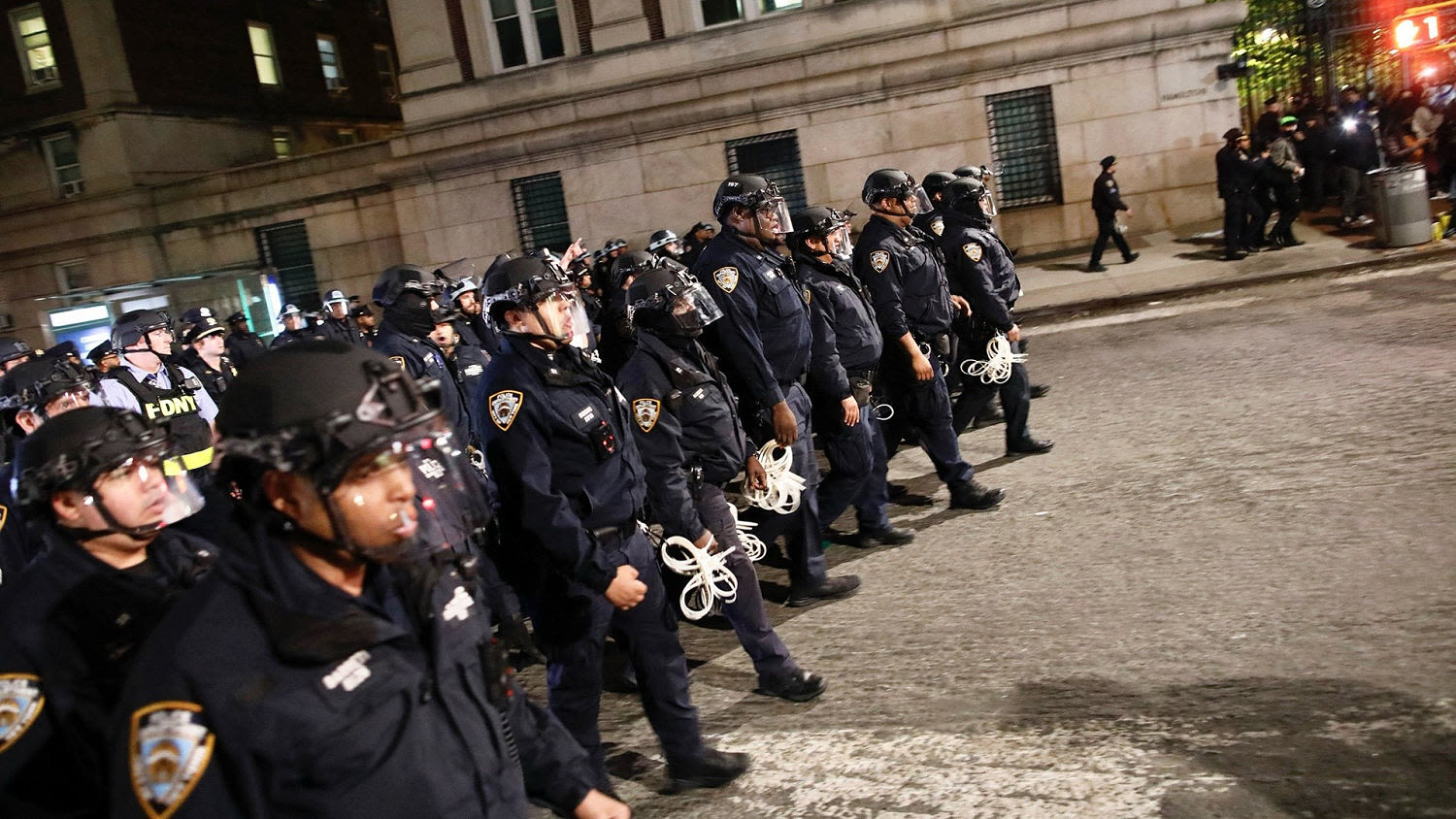 NYPD officers in full riot gear descend on Columbia University campus to clear protesters