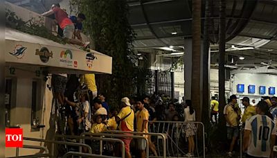 WATCH: Police evict ticketless people as fans climb through vents to enter stadium ahead of Copa America final | Football News - Times of India