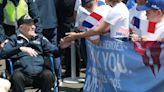 French children hail D-Day veterans as heroes as they arrive in Normandy for anniversary events