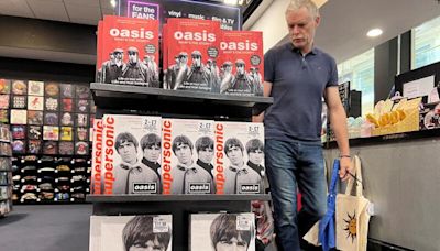 Oasis ticket sales help lift UK shoppers' non-essential spending, survey shows