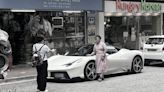 Four middle-aged women surround Ferrari in Tsim Sha Tsui - Dimsum Daily