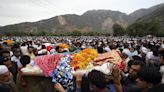 Flash flooding triggered by heavy monsoons kills at least 14 people in northwest Pakistan