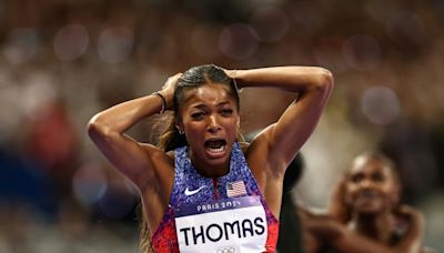 Thomas takes Olympic 200m, Hocker streaks to shock 1500m victory