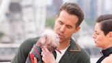 Ryan Reynolds pictured holding Dogpool at Deadpool and Wolverine photo call