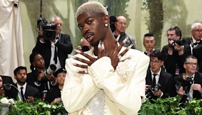 Lil Nas X Rocks Sparkly Suit, Blond Hair and Extra-Long Acrylic Nails for 2024 Met Gala
